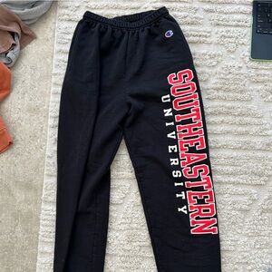 Southeastern University Champion sweatpants, size S, black